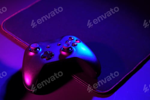 Preview: Gaming joystick on black background in neon light
