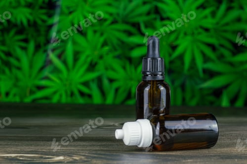 Preview: Closeup of CBD oils in brown glass bottles