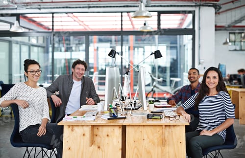 Preview: Make creativity a job. Portrait of a group of young office workers sitting at their work stations.