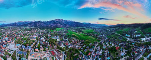 Preview: Aerial view of Tatra mountains and Zakopane town at sunset
