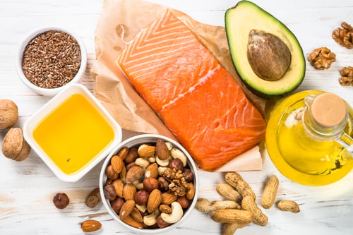 Preview: Healthy fats products at black background.