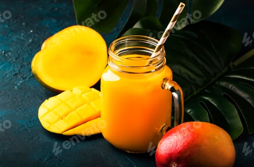 Preview: Mango juice or cocktail in glass jar with fresh fruit