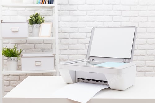 Preview: Printer in a minimalist office setting with paper output on a clean desk during daytime