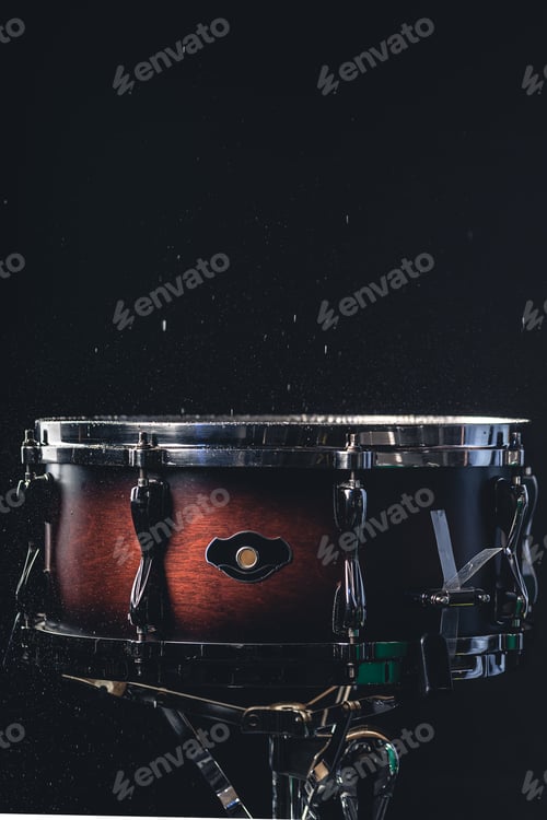 Preview: Beautiful snare drum on a black background, close up.