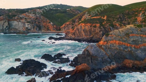 Preview: Aerial ocean breaking cliffs morning. Water crashing rugged stones sea foaming