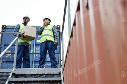 Preview: Two workers at shipping docks