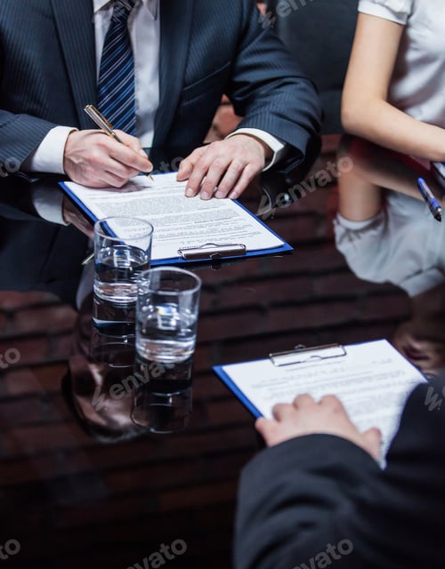 Preview: Businessmen subscribing the agreement
