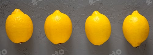 Preview: Fresh Ripe Yellow Organic Lemons on gray surface, top view. Flat lay, overhead, from above.