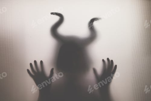 Preview: Horror, halloween background - Shadowy figure with horns behind the glass
