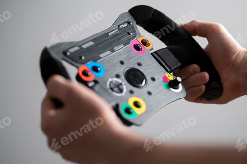 Preview: a race driver holding a sport car steering wheel