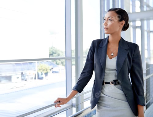 Preview: Always focused on the future. A thoughtful businesswoman gazing out of the window.