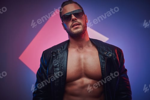 Preview: Portrait of handsome muscular man in the photo studio