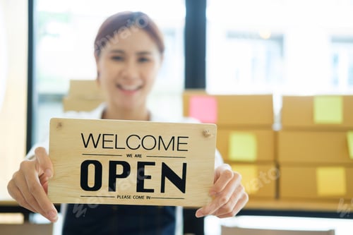 Preview: Close up Young business owner open the coffee shop.