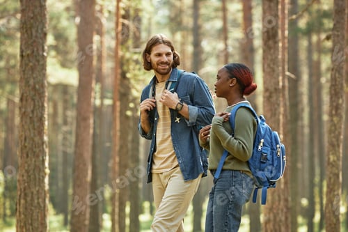 Preview: Young couple walking together outdoors