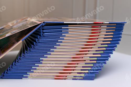 Preview: photo books are in a stack.