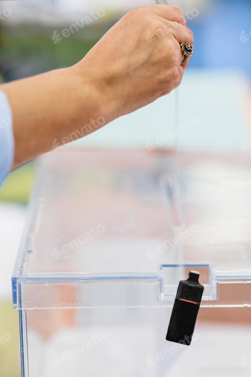 Preview: voting rights. Gypsy vote referendum suffrage unrecognizable female hand hold envelope closeup
