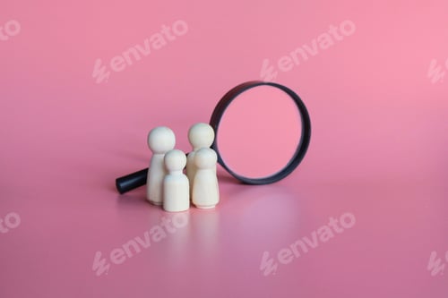 Preview: Wooden dolls and magnifying glass