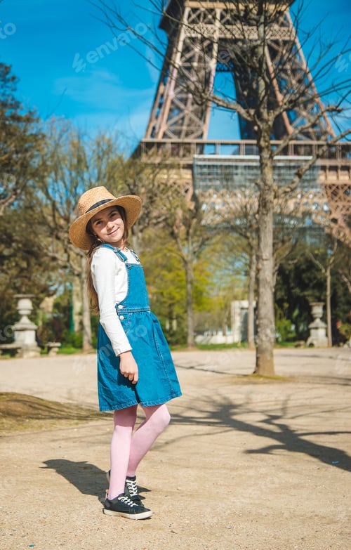 Preview: Children in Paris near the Eiffel Tower. Selective focus.