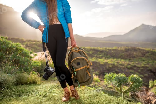 Preview: Traveler with photocamera and backpack