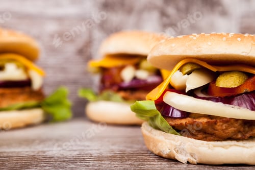 Preview: Close up of Delicious home made burgers on wooden plate