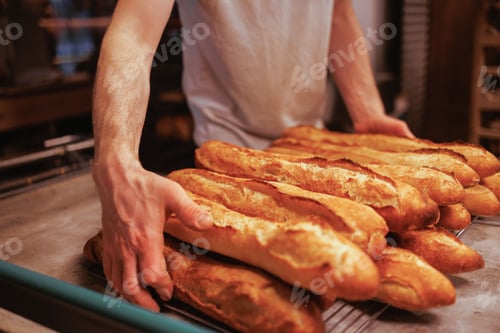 Preview: Baker working in the kitchen, preparing loaves of bread
