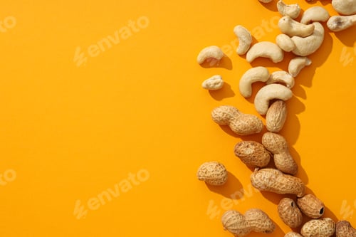 Preview: Assortment of different nuts on an orange background