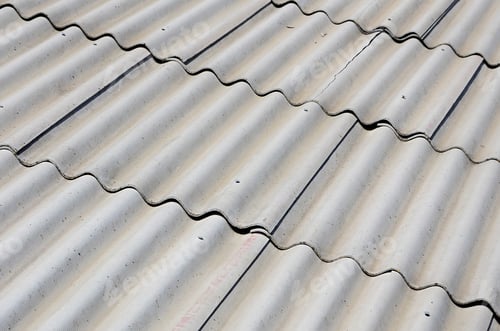 Preview: A fragment of a gray slate roof of an old sample made of asbestos material