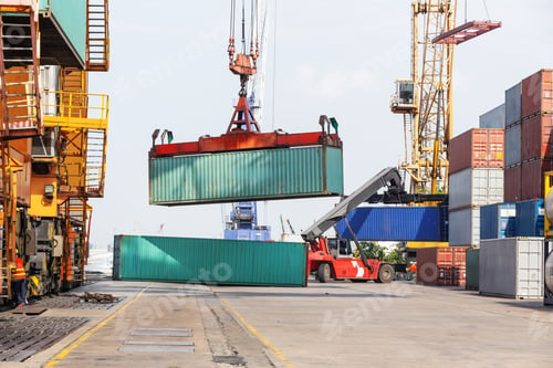 Preview: A container yard with stacked cargo containers and cylindrical tanks