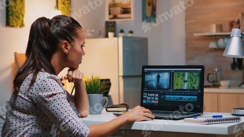Preview: Videographer editing from home on professional laptop