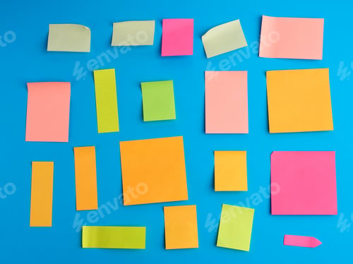 Preview: Multicolored paper stickers of different shapes on a blue background