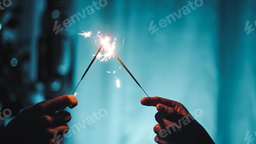 Preview: Sparklers on blue background. Happy new year,