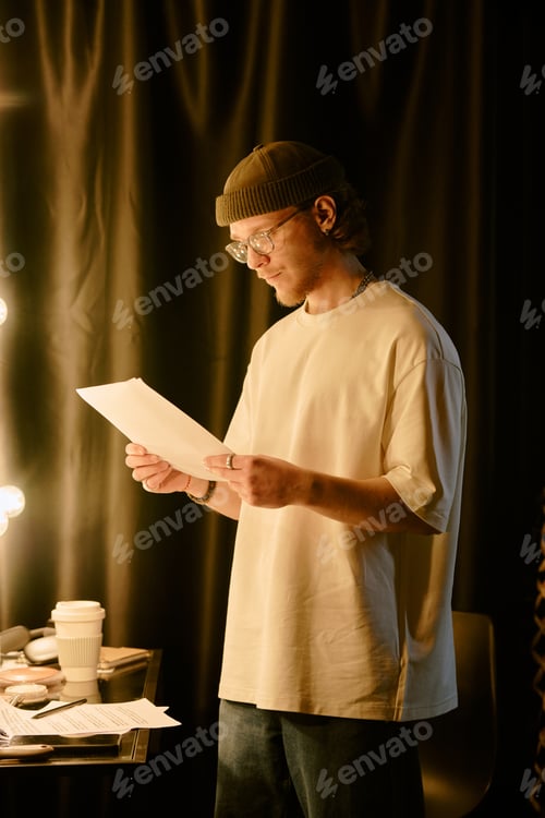 Preview: Reading Document in Dimly Lit Room by Lamp Light