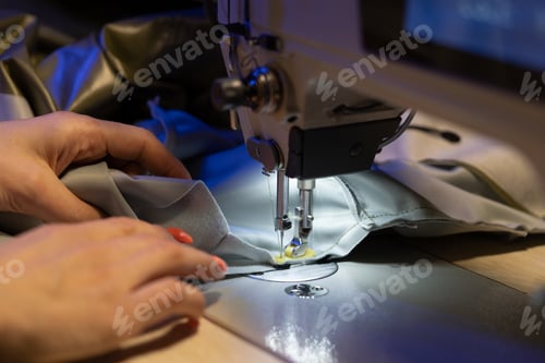 Preview: Seamstress work on sewing machine, closeup. Woman fashion designer create new clothes collection