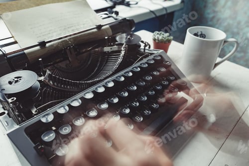 Preview: Writer typing with retro writing machine.
