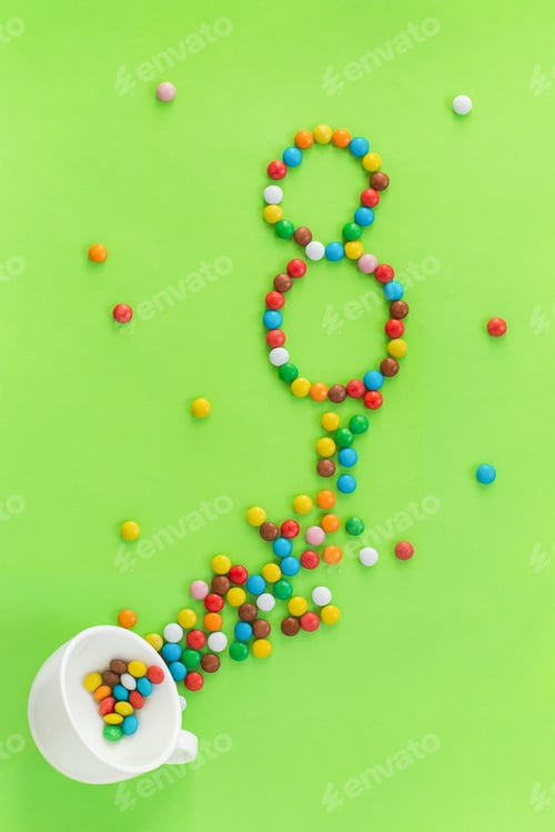 Preview: 8 of the colorful candies flowing out of the coffee mug.