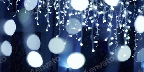 Preview: Blue lights bokeh from christmas holiday garlands, blurred festive background, abstract lights