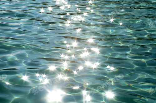 Sparkling Water Surface with Reflections and Ripples