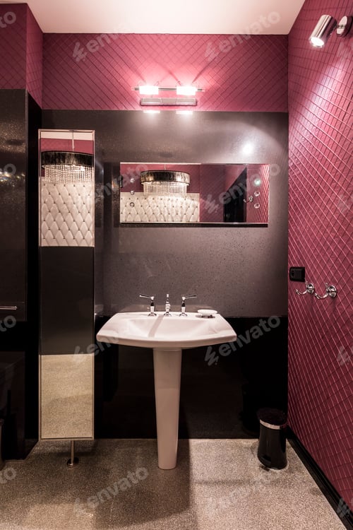 Preview: White sink in dark bathroom