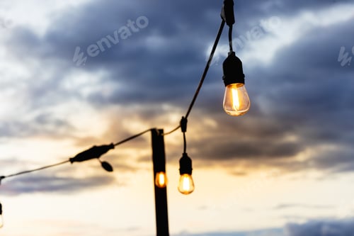 Preview: electric lamp on the background of the sunset sky