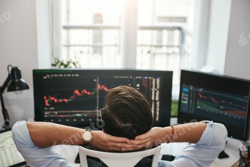 Preview: Back view of young businessman or trader holding hands behind head