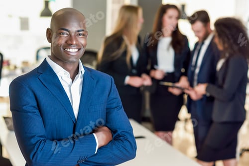 Preview: Businessman leader in modern office with businesspeople working