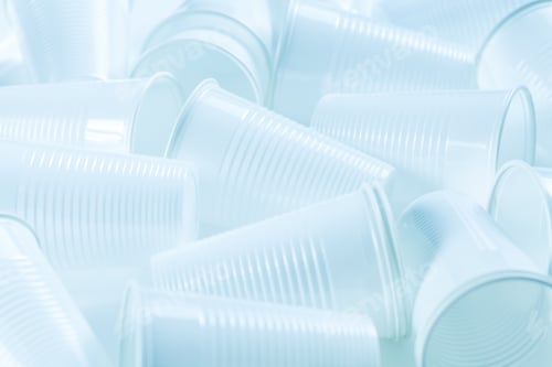 Preview: Disposable plastic cups as background. Environmental concept. Non-compostable waste