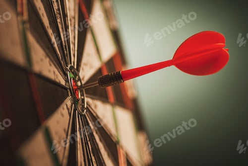 Preview: Successful bulls eye centre dart on a target