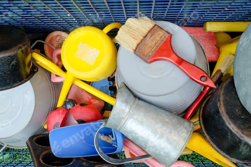 Preview: Colorful array of common household items and tools in a disorganized arrangement