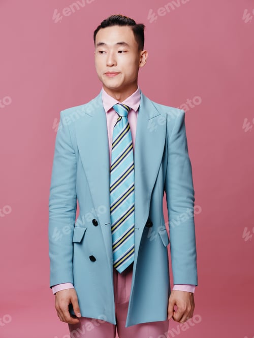 Preview: Cute elegant man of Asian appearance blue jacket striped tie cropped view