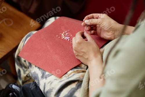 Preview: Woman Creating Beaded Embroidery on Fabric Surface