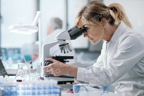 Preview: Professional scientist using a microscope