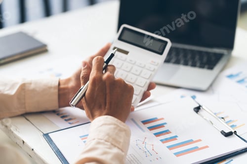 Preview: Close up hand of stress young asian businessman,male is pressing a calculator to calculate tax inco