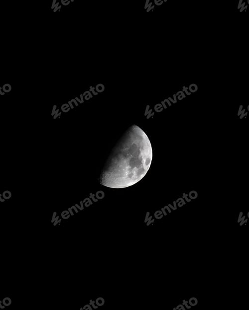 Preview: Partially obscured moon illuminated in a night sky