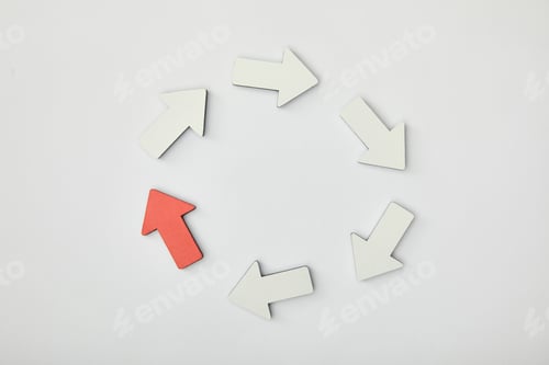 Preview: top view of white arrows and red pointer in circle on grey background